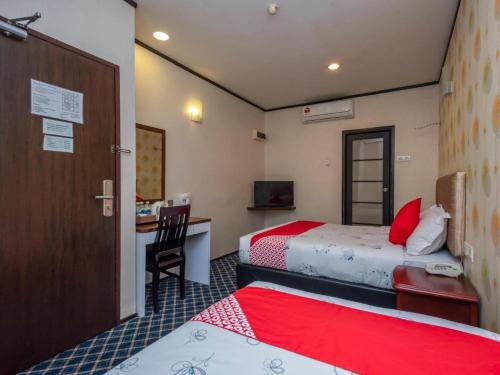 Postel nebo postele na pokoji v ubytování Suan Bee Hotel@Sutera