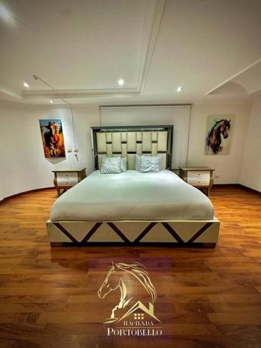 Säng eller sängar i ett rum på Hacienda en Chia