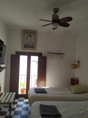 Ένα ή περισσότερα κρεβάτια σε δωμάτιο στο Las 3 Puertas 1