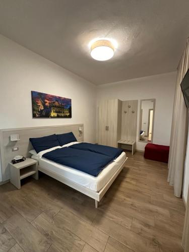 Ένα ή περισσότερα κρεβάτια σε δωμάτιο στο Residenza Pezzani