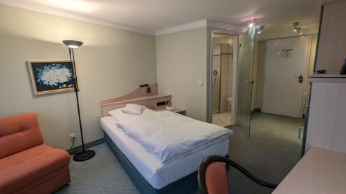 Postel nebo postele na pokoji v ubytování Hotel Gasthof Lang