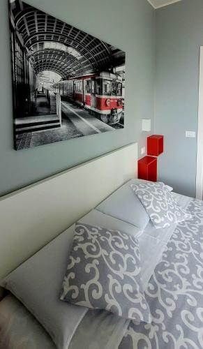 a bedroom with a picture of a train station at Al Binario Brescia in Brescia