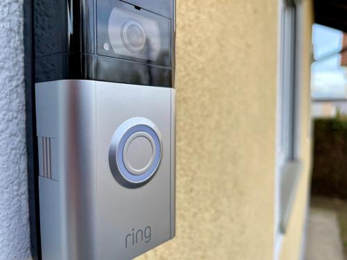 a close up of a cell phone on a wall at SHOME CityHouse Graz I Self Check-in in Graz