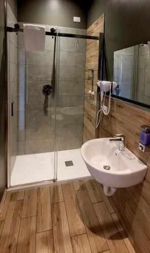 a bathroom with a shower and a sink at Al Binario Brescia in Brescia