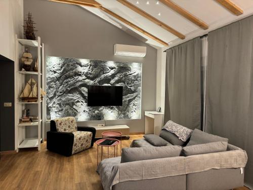 a living room with a couch and a tv at Barbie's House in Žerava