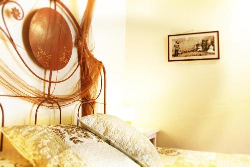 a bedroom with a bed with a mirror on the wall at Cal Pallerola in Montargull de la Vansa