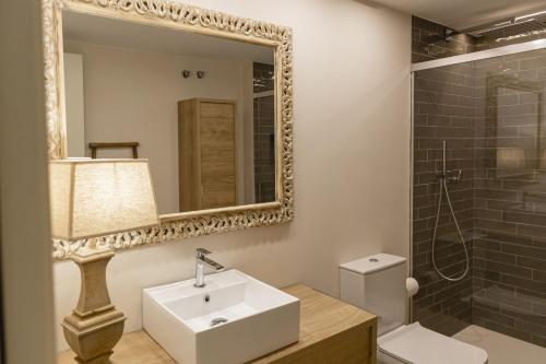 a bathroom with a sink and a mirror at Emporda Golf 28 2-1 in Gualta