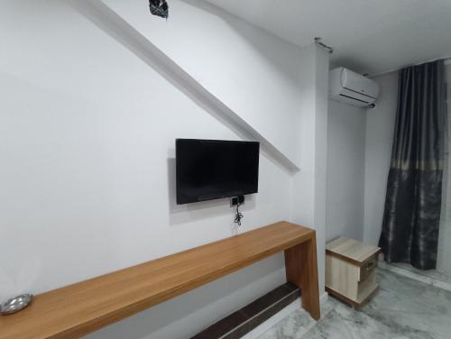 a room with a flat screen tv on a wall at dara otel in Midyat
