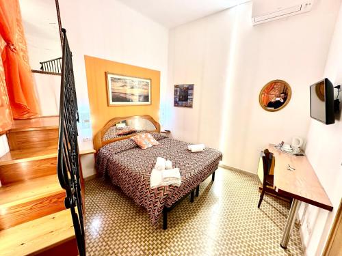 a bedroom with a bed in a room at The Vernazza Main Plaza - Rooms & Apartment in Vernazza