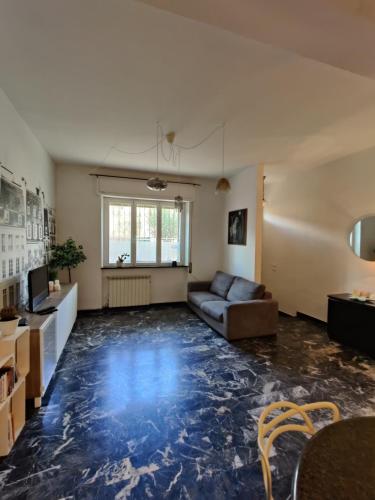 a large living room with a couch and a table at Casa Stella in Viareggio