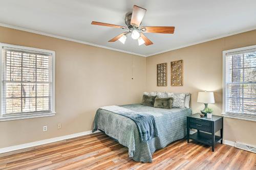 a bedroom with a bed and a ceiling fan at Spacious Starkville Home 4 Mi to MSU Campus in Starkville