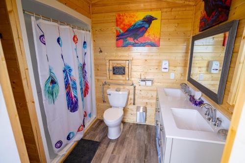 a bathroom with a toilet and a sink at Ravens Rest Retreat 