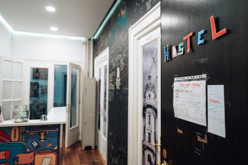 a room with a black wall with the word lease on it at Hostel Beogradjanka in Belgrade