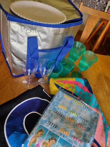 a table with two glasses and a lunch box at Angel 8 AirBnB Apartment 1 in Robertson