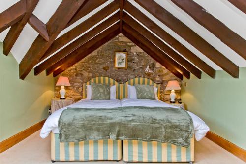 a bedroom with a large bed in a room at Cairngorms Castle in Cray