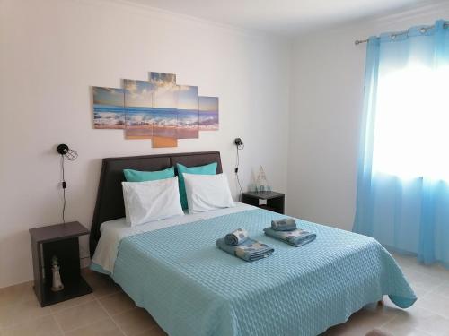 Ένα ή περισσότερα κρεβάτια σε δωμάτιο στο Azimute Guest House