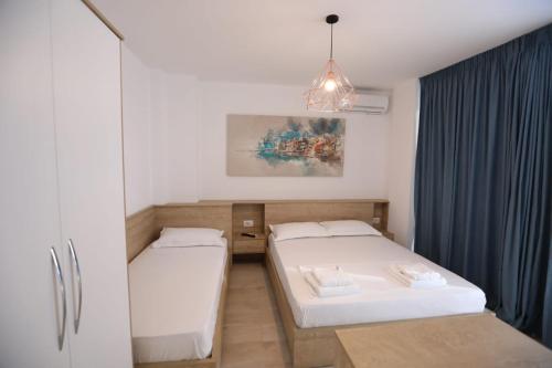 Postel nebo postele na pokoji v ubytování Apart-Hotel Alvi