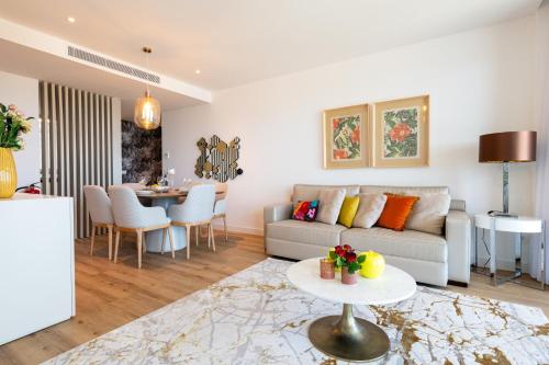 a living room with a couch and a table at The Queen Apartment By Sam Houses in Funchal