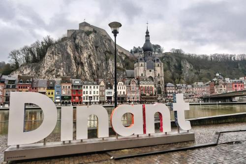a large sign in front of a city at Monsieur Michel in Dinant