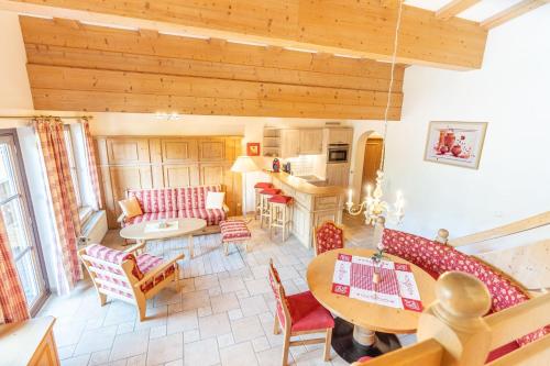 a living room with a couch and a table at Landhaus Schenk Storchennest in Bad Hindelang