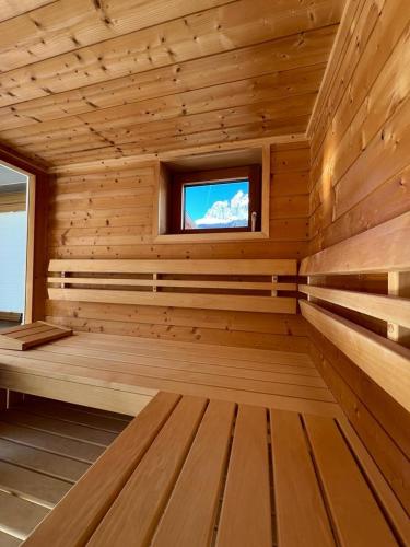 a wooden sauna with a television in it at Wetterstein-Chalet in Leutasch