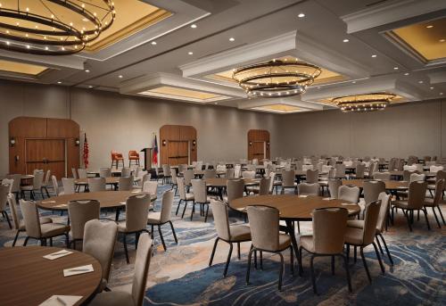 a large room with tables and chairs in it at Plaza San Antonio Hotel & Spa, Autograph Collection in San Antonio