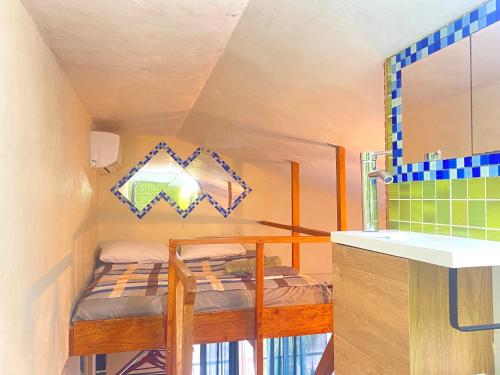 a small room with a bunk bed and a sink at Private Study Punta Cana in Punta Cana
