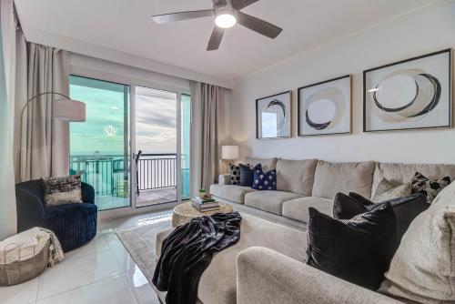 a living room with a couch and a view of the ocean at Gorgeous Oceanview 3BR Luxury Condo - Latitude in Gulfport