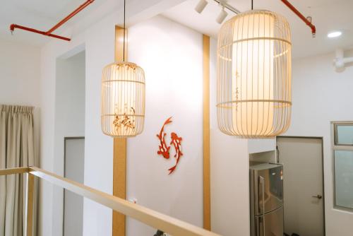 a room with three chandeliers hanging from the ceiling at Mount Austin Manhanttan Sovo by Cactus Homestay in Johor Bahru