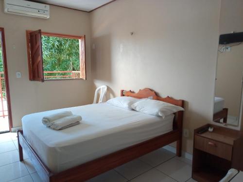 Postel nebo postele na pokoji v ubytování BELAS PRAIAS POUSADA