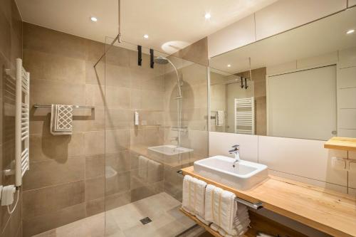 a bathroom with a sink and a mirror at Stoana Apt 4-2 in San Giacomo