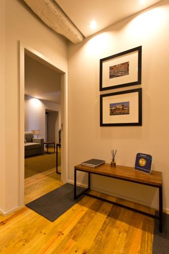 a living room with a table and a couch at RVA - Gustave Eiffel Apartments in Porto