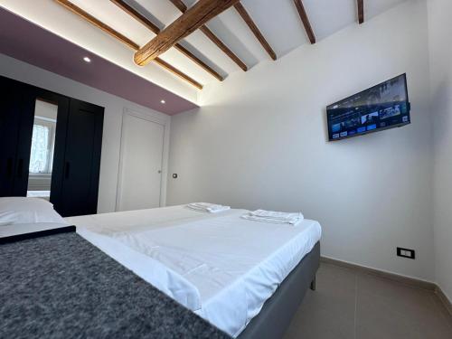 Ένα ή περισσότερα κρεβάτια σε δωμάτιο στο La Casa di Nonno Bino