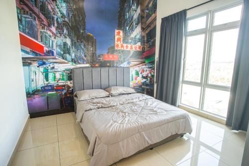 a bedroom with a large bed with a painting on the wall at Mount Austin Manhanttan Sovo by Cactus Homestay in Johor Bahru