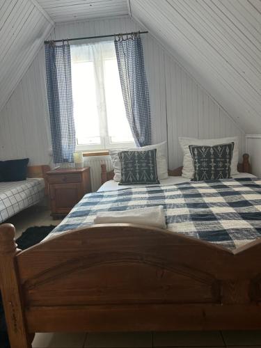 a bedroom with a large bed in a attic at Mała Bawaria in Zakopane