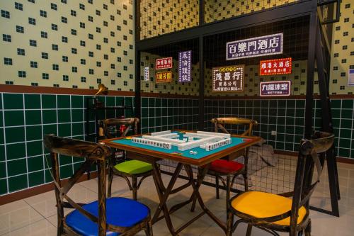 a table with chairs and a cake on top of it at Mount Austin Manhanttan Sovo by Cactus Homestay in Johor Bahru
