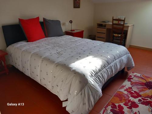 a bedroom with a large bed with a white comforter at Studio pratique, Garage gratuit, Esprit Auber in Béziers