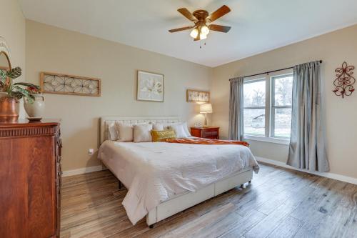 a bedroom with a bed and a ceiling fan at Country Home Near Fredericksburg Fire Pit and Grill in Tivydale