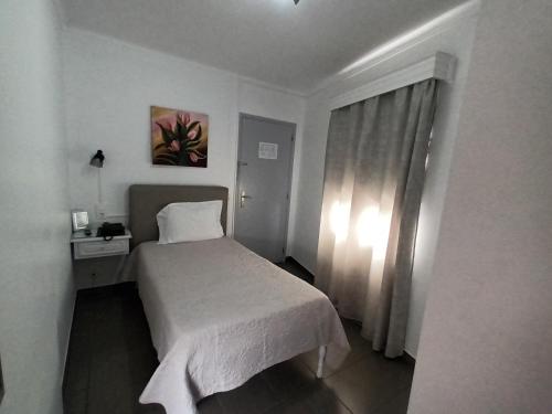 Hotel Branco Iにあるベッド