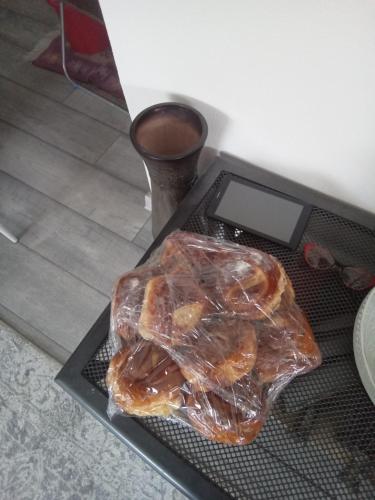 a tray with two pastries in plastic on a table at Casa Ozon in Vulcan