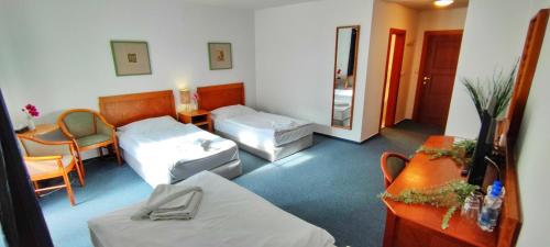 Una cama o camas en una habitación de Hotel Magnolia