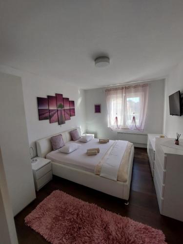 Postel nebo postele na pokoji v ubytování Apartman Nora