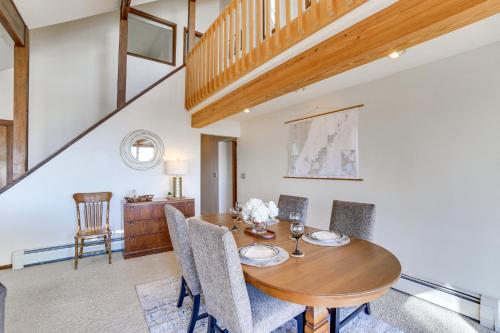 a dining room with a wooden table and chairs at Private Beach and Deck Spacious Lake Michigan Home in Menominee