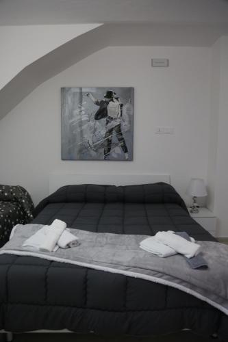 a bedroom with a bed with two towels on it at IL BORGO in Quattromiglia