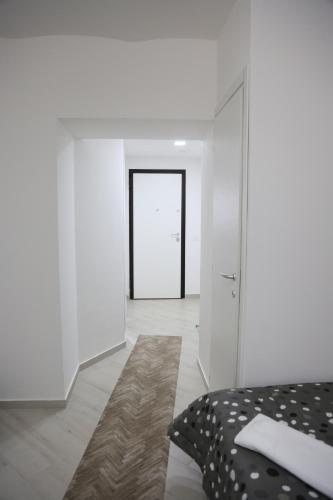 a bedroom with a bed and a door with a doorway at IL BORGO in Quattromiglia