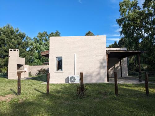a small house with a roof at Portal Del Campo in Piriápolis