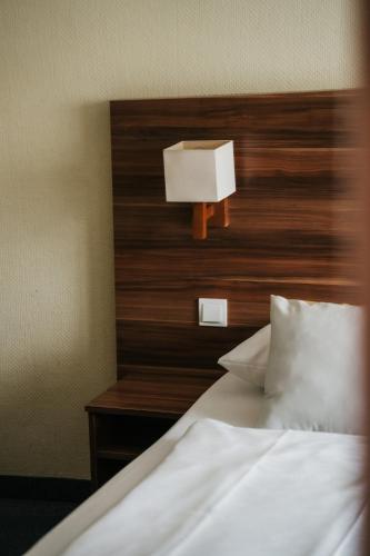 Ένα ή περισσότερα κρεβάτια σε δωμάτιο στο Savoy Hotel