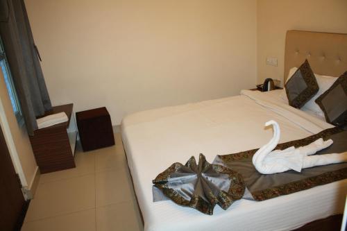 En eller flere senge i et værelse på Raghunath Palace Home Stay