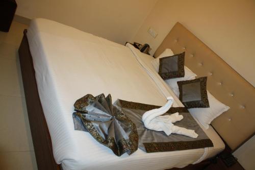 Ένα ή περισσότερα κρεβάτια σε δωμάτιο στο Raghunath Palace Home Stay