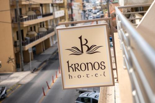 a sign for a horizons hotel on a street at Kronos Hotel in Heraklio Town